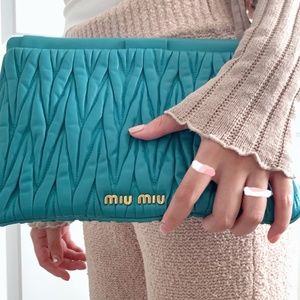 (RESERVED) Miu Miu Matelassé turquoise colored leather clutch